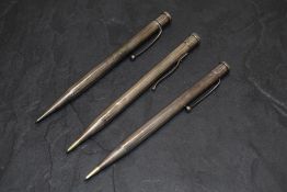 Three Yard o Led Hallmarked Silver pencils. All round one smooth two engine turned. Dated London