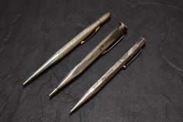 Three Sterling Silver pencils. A hexagonal Yard O Led engine turned (as Found), a triangular Yard