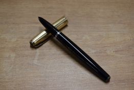 A Parker 51 vacumatic fill fountain pen in Black (twin jewel) with Gold fill parallel line cap.
