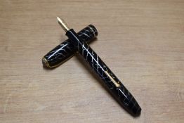 A Conway Stewart 28 lever fill fountain pen in Black Cracked Ice with single cap band having