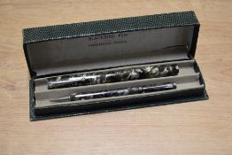 A boxed Mabie Todd & Co Blackbird 5245 lever fill fountain pen and Fyne Point pencil set in Green