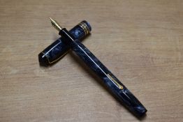 A boxed Conway Stewart 388 lever fill fountain pen in Blue Marble with a broad and two narrow cap