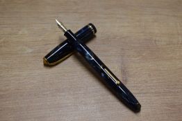 A Conway Stewart 12 lever fill fountain pen in Blue Marble with Gold veining with single narrow