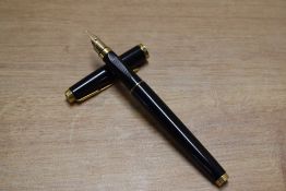 A Parker 75 converter fill fountain pen in Black Laque gold trim having Parker 585 France nib.