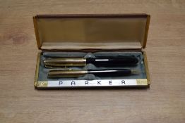 A boxed Parker 51 vacumatic fill fountain pen and Pencil set in Cordovan Brown with Gold Fill