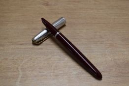 A Parker 51 aerometric fill in Burgundy with Rolled Silver converging line cap with gold clip. Circa