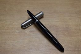 A boxed Parker 51 aerometric fill fountain pen in Black with a lustraloy cap. Circa 1955. Engraved