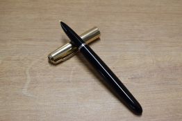 A Parker 51 aerometric fill fountain pen in Black with Rolled Gold converging line cap. Circa 1960