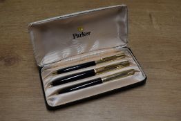 A boxed Parker 61 Custom Insignia capillary fill fountain pen, ballpoint pen and pencil set in Black