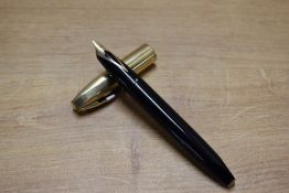 A Sheaffer Pen For Men V snorkel fill fountain pen in Black with Gold Fill cap having Sheaffer 14K