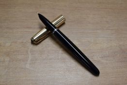 A Parker 51 aerometric fill fountain pen in Black with Gold fill cap. Circa 1948