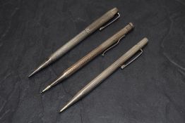 Three Yard o Led Hallmarked Silver pencils. All round one smooth two engine turned. Dated London