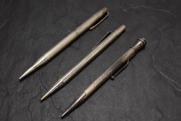 Three Yard o Led Hallmarked Silver pencils. All round, all engine turned. Dated Birmingham 1939,