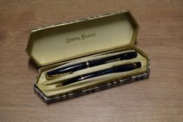 A boxed Conway Stewart 12 lever fill fountain pen and Nippy 5 pencil set in Blue marble with Brown