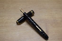 A Conway Stewart 58 lever fill fountain pen in Black Cracked Ice with single broad and two narrow