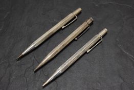 Three Yard o Led Sterling and Hallmarked Silver pencils. All hexagonal, all engine turned. Two dated