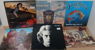 A seven album lot with titles by Steve Miller , JJ Cale , Al Stewart and more VG/VG+ in general