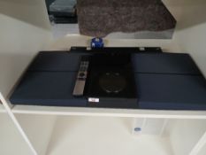 A Bang and Olufsen wall mounted CD/Cassette system with remote control - a nice stylish retro piece