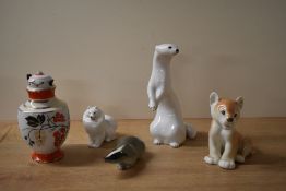 A group of four USSR Lomonosov porcelain animal studies to comprising a lion Cub, Pomeranian dog,