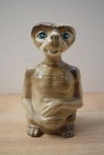 A 20th century E.T ceramic figure formed as a money box, measuring 19cm tall.