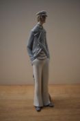 A Lladro porcelain figure, 'Sea Captain' model number 4621, measuring 37cm tall, damaged pipe from