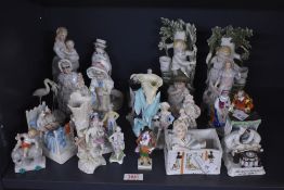 A miscellaneous selection of Capodimonte and similar style figures and figurines, largest