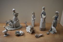 A group of eight Lladro and Nao by Lladro porcelain studies to include 'Girl with Duck' model number