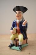 A 19th century Staffordshire pottery Toby character jug of William Kent 'Squire', depicting the