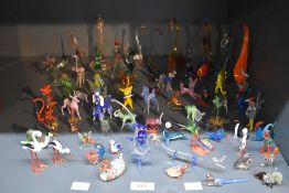 A large assortment of mid 20th century hand blown glass animals to include sea-lion, cockerel,