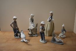 A group of seven Lladro and Nao by Lladro porcelain figures/figurines and animal studies to