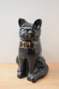 A large pottery fireside cat study, black gloss finish, measures 31cm tall, no markings or