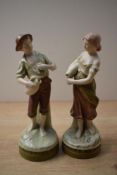 A pair of Royal Dux porcelain water carrier figures comprising model numbers 2221 and 2223, both