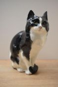 A large J Winstanley fireside Persian cat study, black and white gloss finish, having signature to