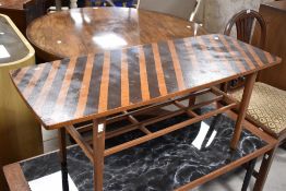 A vintage coffee table having stripe design, approx. 106 x 40cm