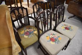 A group of five George III mahogany dining chairs, 4+1 carver, each with shaped top rail and