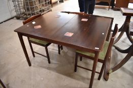 A vintage fruitwood (possibly Cherry) extending dining table and three similar chairs, sold with a