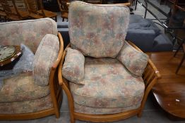 A modern Ercol low back three piece lounge suite and a similar footstool