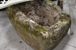 A limestone trough, maximum dimensions approx H33cm W55cm D47cm