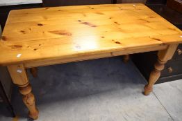 A traditional pine kitchen dining table, approx. 137 x 76cm