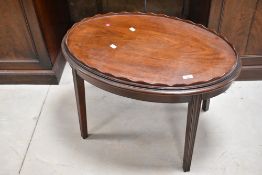An early 20th Century mahogany tray table of oval form, approx. 77 x 55cm