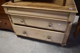 A 19th Century stripped pine wash stand or bedroom chest , having frieze drawers over two long