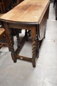 An early 20th Century twist gateleg table and set of four similar chairs plus a similar carver