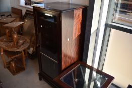 Three pieces of late 20th Century mahogany effect occasional furniture comprising hifi cabinet,