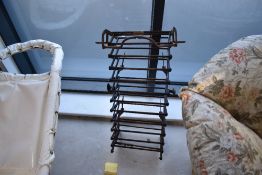 A vintage metal escape ladder having concertina action