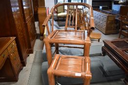 A Chinese bamboo armchair, having a tub style bent back and arms, sold with footstool, seat height