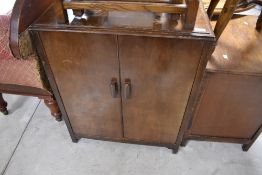 A vintage HMV record cabinet having compartmental interior, dimensions approx. W66 H82 D43cm