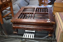A Chinese low table, of square section form with spindled top over traditional design supports and