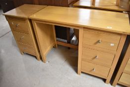 A modern Corndell Nimbus range light oak finish dressing table and two similar bedside drawer sets ,