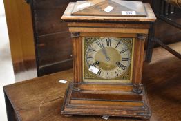 A 19th Century German mantel clock in distressed case