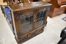 A vintage Priory style bookcase, approx dimensions. H104 W100 D30cm